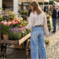 Dammjeans med vida ben och påsydda fickor