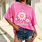 Unisex-T-shirt i lös passform med vintage-tvättat daisy-mönster