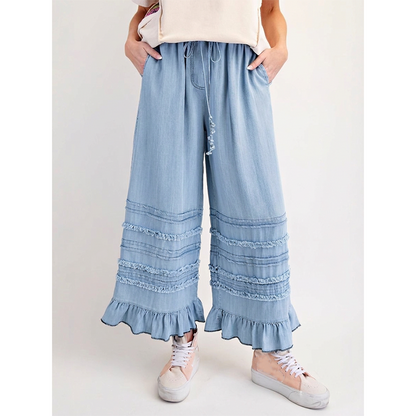 Dambyxor i Tencel-denim med volangkant och vida ben