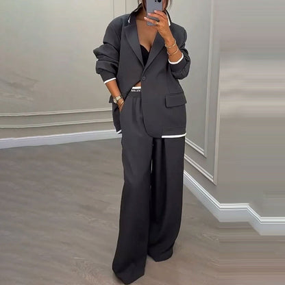 Set med elegant damblazer och byxor med vida ben