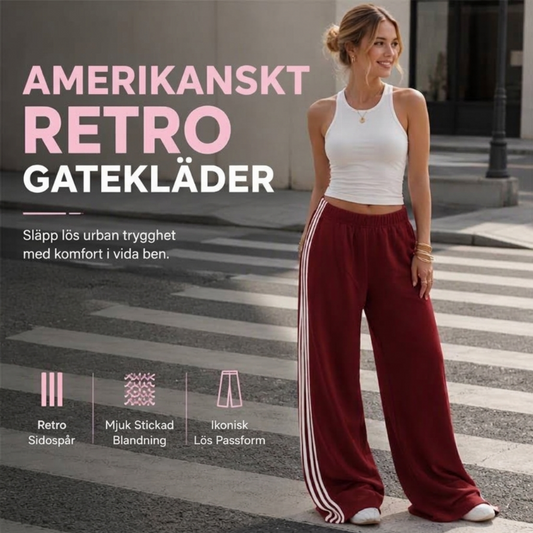 Damens vidbenta joggingbyxor med sidoränder